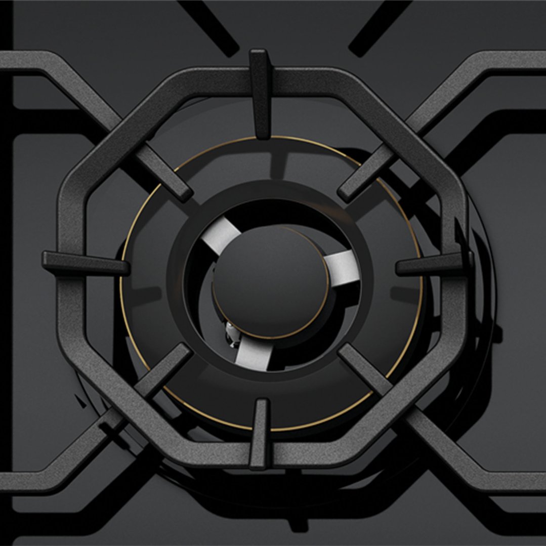 Close up overhead view of a black gas cooktop burner