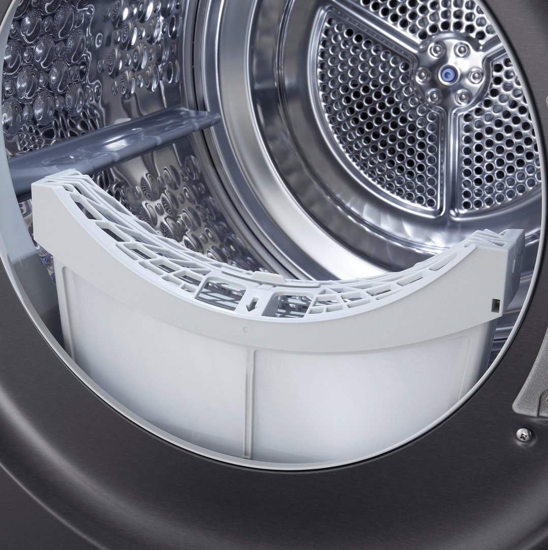 Close-up of the interior drum and lint filter of a dryer