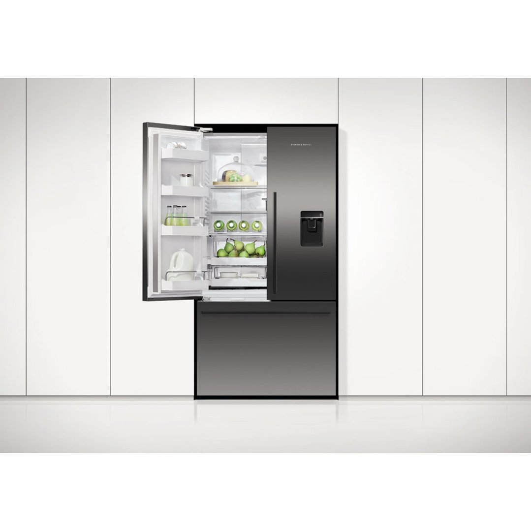 Open French door refrigerator freezer with ice and water dispenser in a kitchen