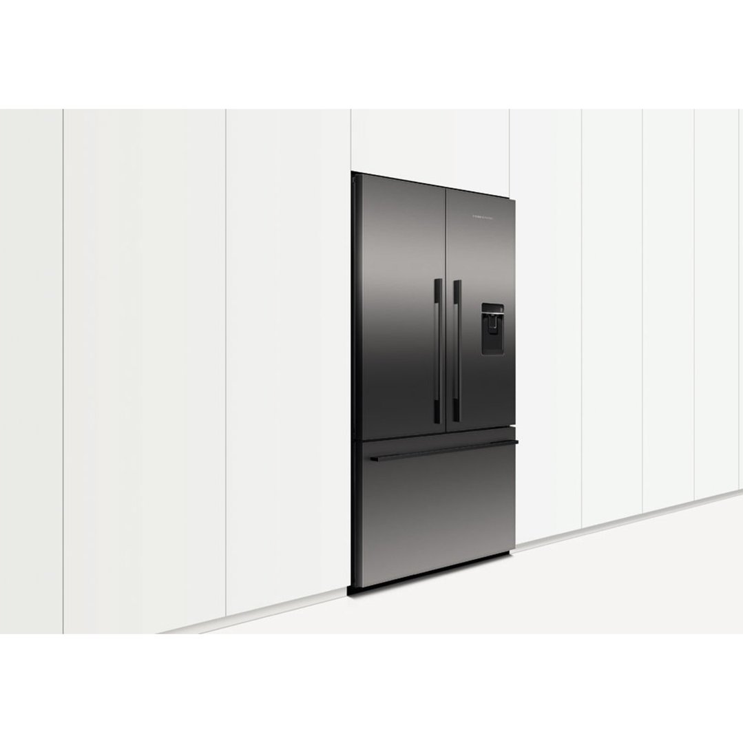 Dark stainless steel French door refrigerator freezer built into a white kitchen