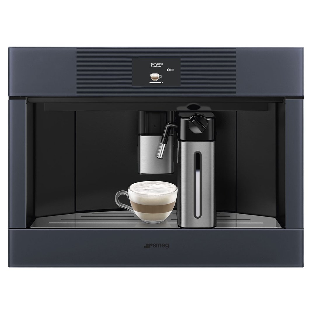 Built-in coffee machine dispensing cappuccino into a glass mug with milk frother