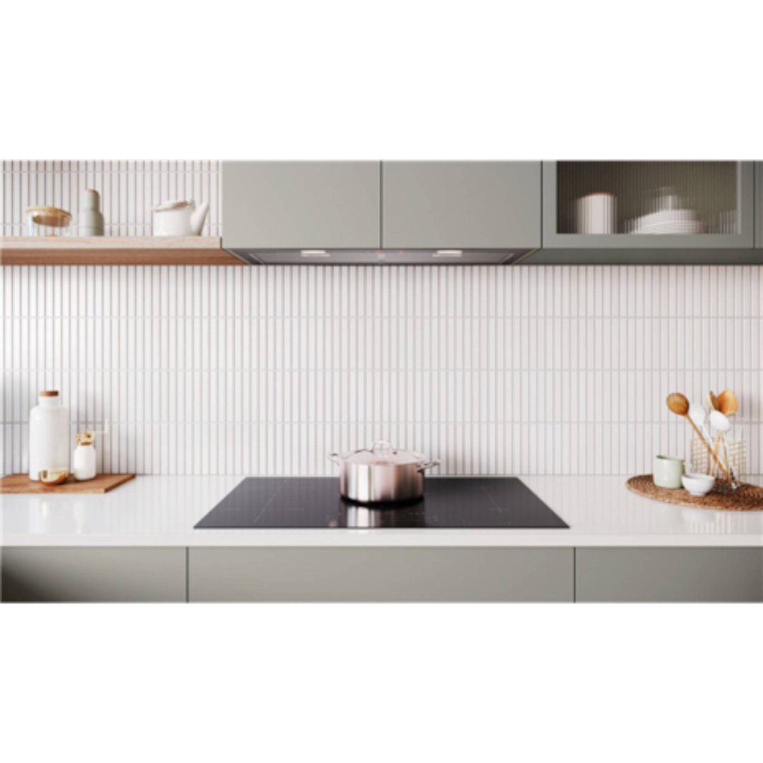 Induction cooktop with a pot on it, in a modern kitchen setting