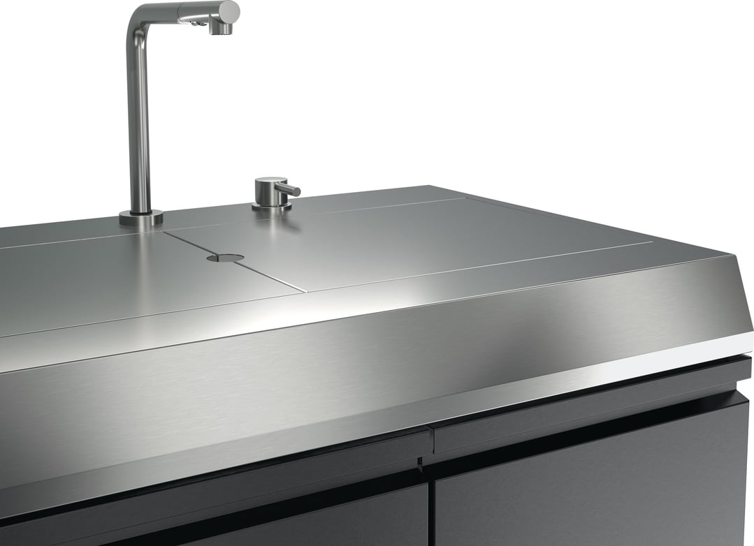 Close up of a stainless steel outdoor kitchen sink module