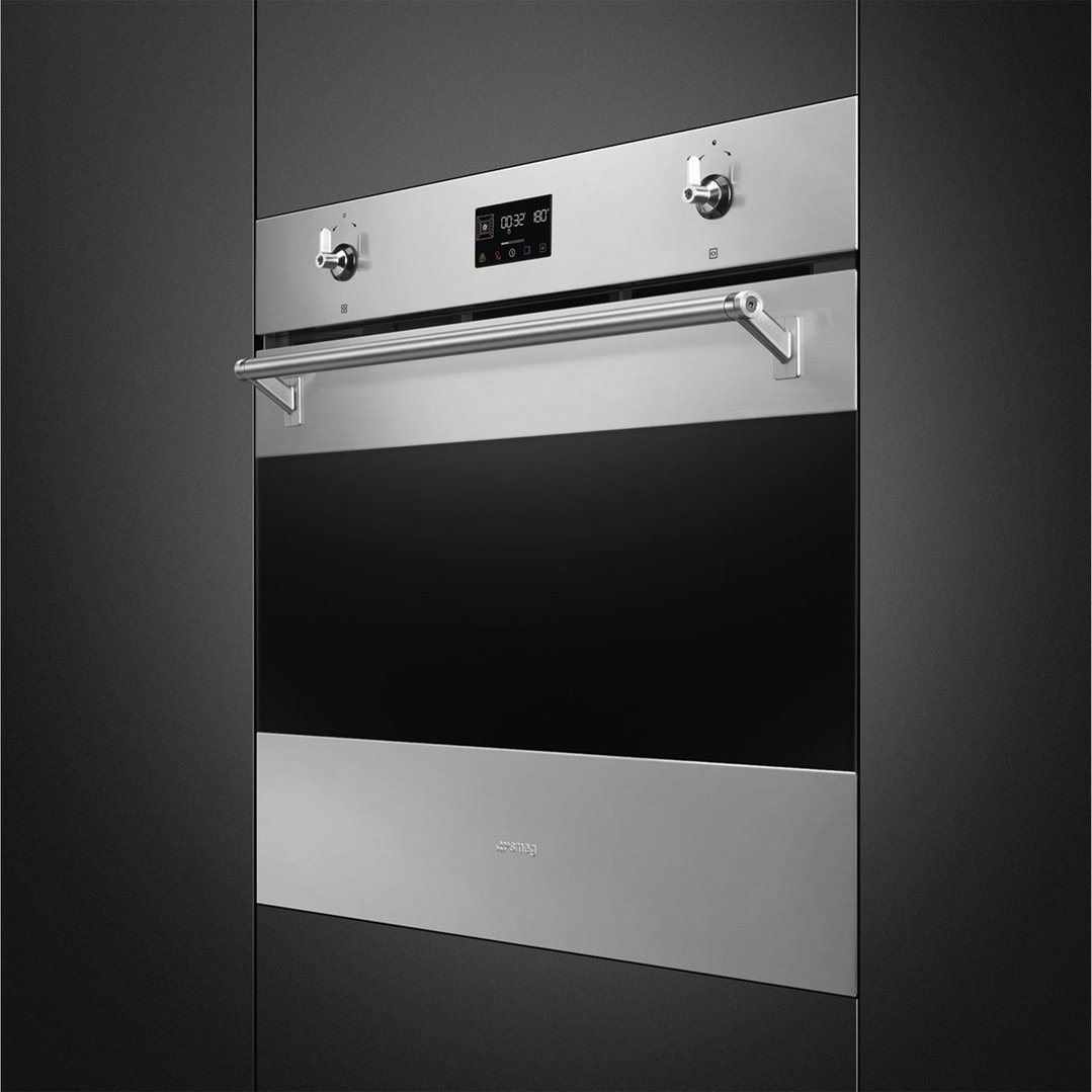 A built-in SMEG oven with a stainless steel finish and black glass door