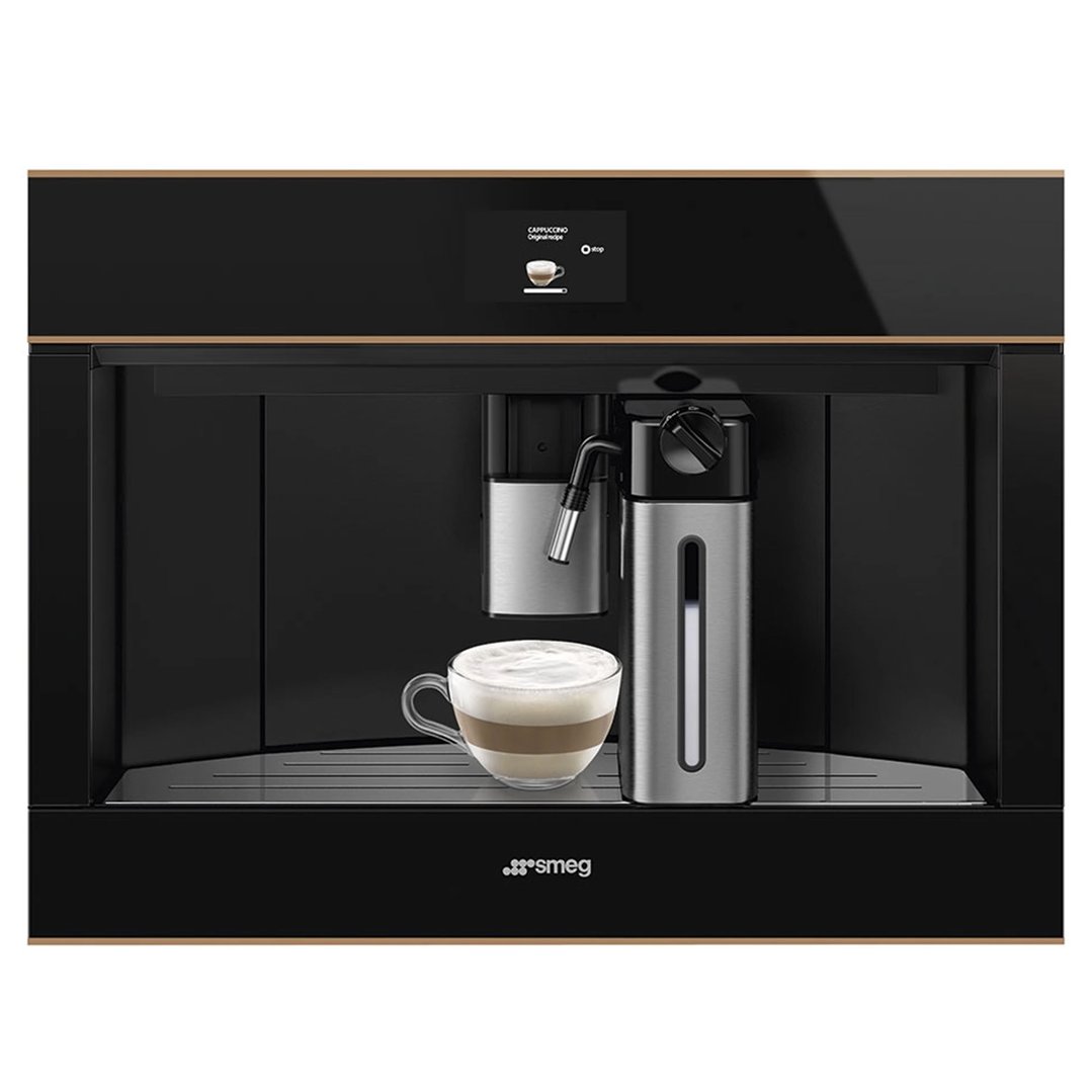 Built-in coffee machine making a cappuccino in a glass cup