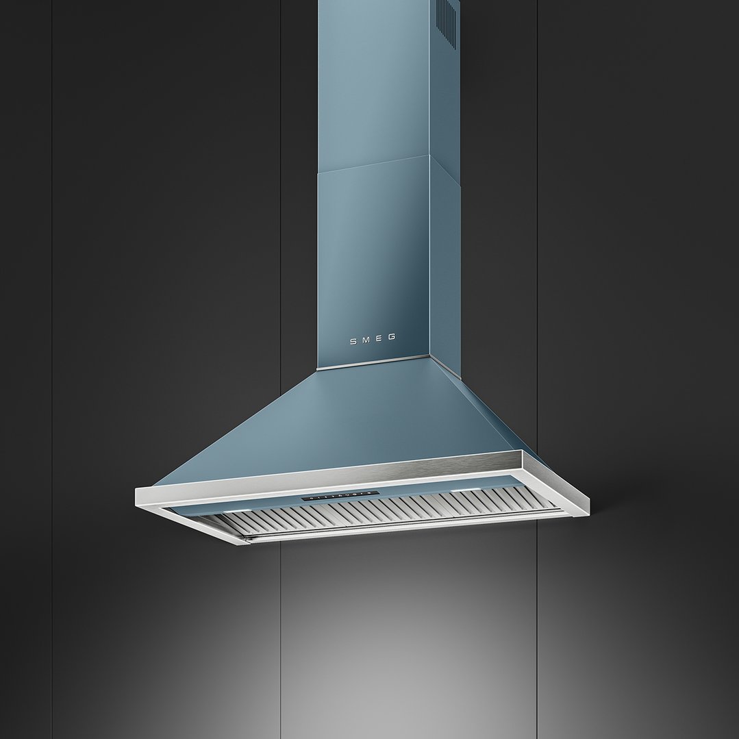 A blue SMEG rangehood with lights on, mounted on a dark wall