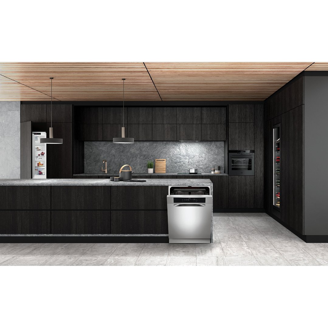 Stainless steel dishwasher in a modern kitchen with dark cabinetry and stone benchtops