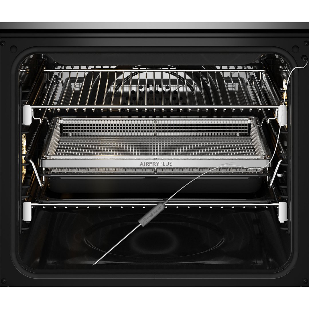 Inside view of a dark stainless steel oven with an AirFryPlus basket