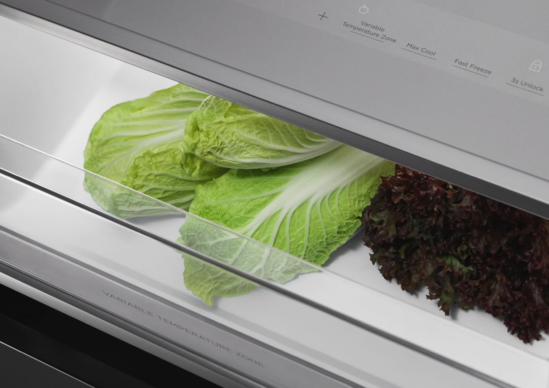 Close up of fresh lettuce and cabbage in a refrigerator drawer