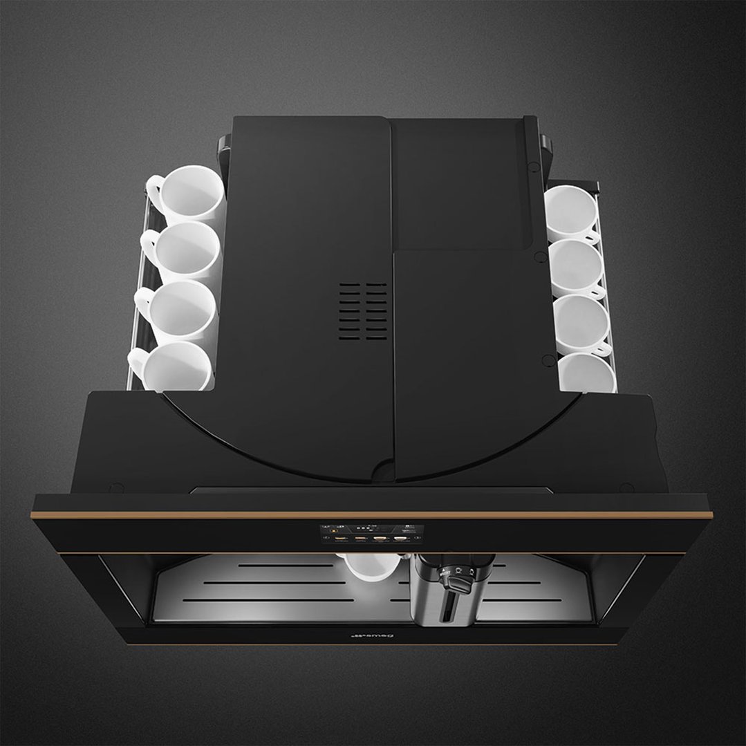 Overhead view of a built-in coffee machine with cups on either side