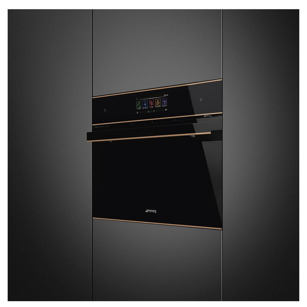 Black built-in compact microwave oven with a bronze trim in a dark kitchen