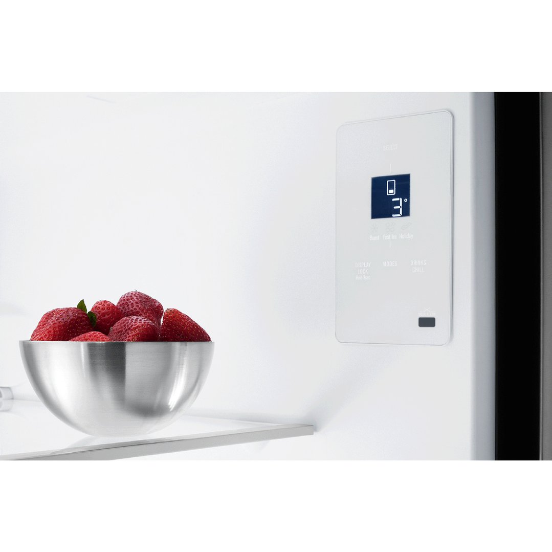 Bowl of strawberries on a shelf inside a refrigerator with digital display