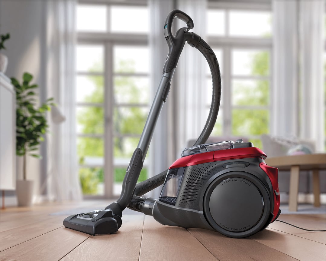 Red and black Electrolux Pure C9 Animal vacuum cleaner on a wooden floor