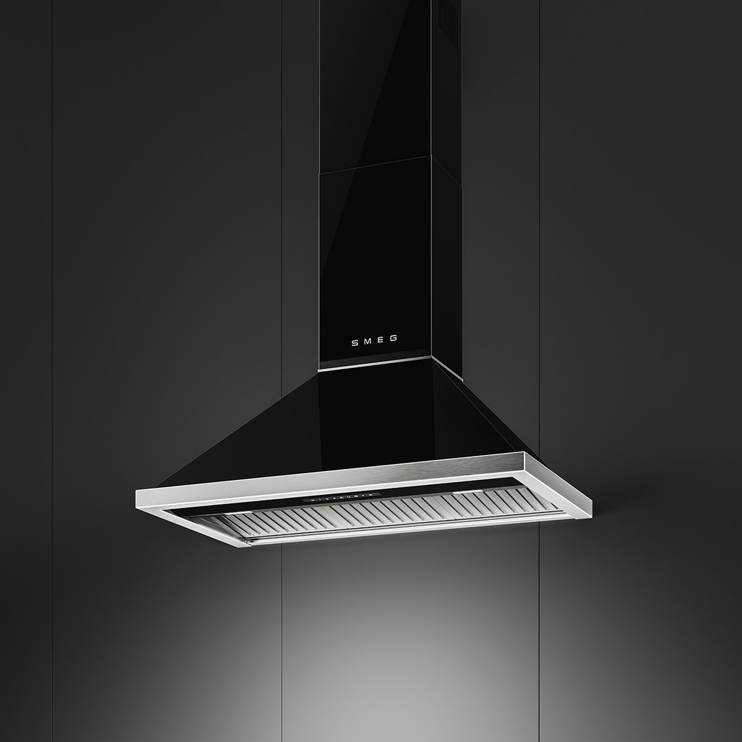 Black Smeg canopy rangehood with stainless steel trim against a dark wall