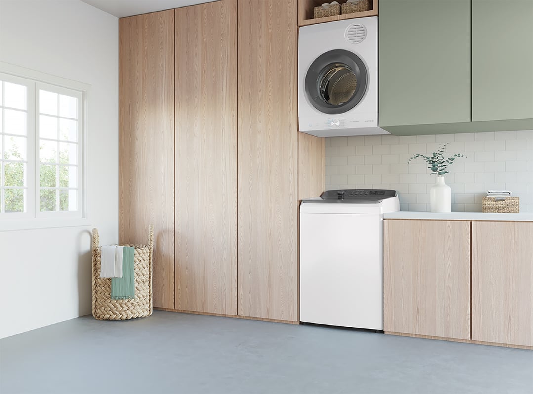 Top load washing machine and dryer in a modern laundry room