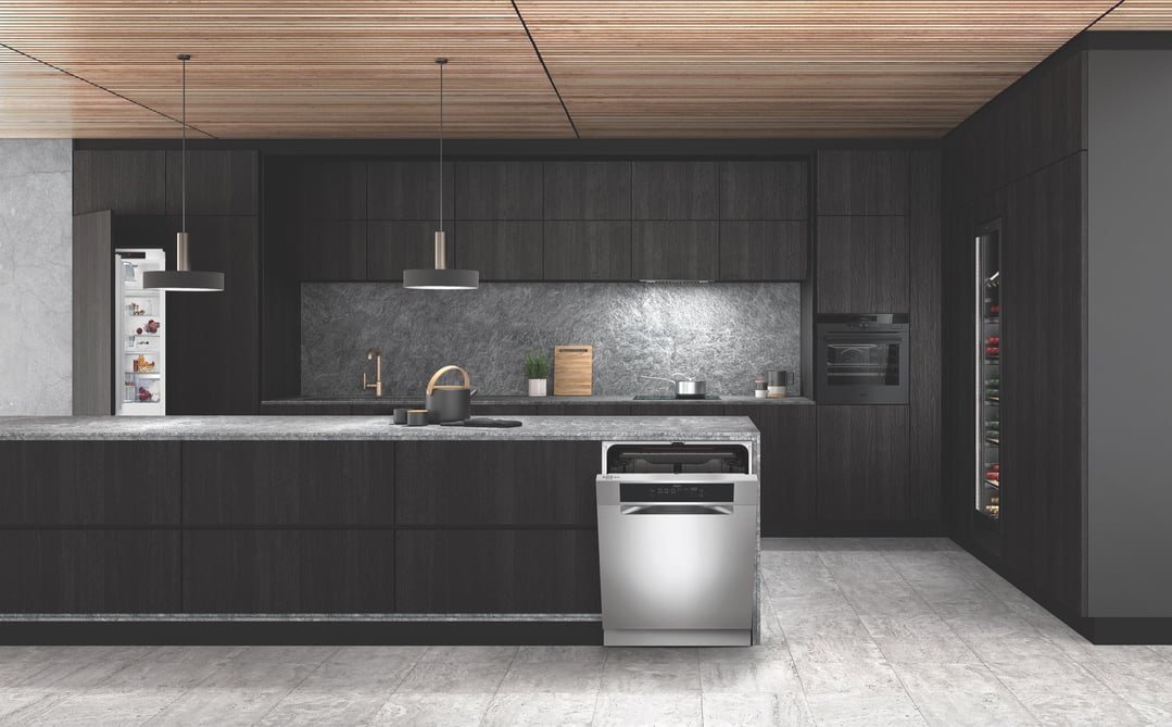 Stainless steel dishwasher built into a dark kitchen island in a modern kitchen