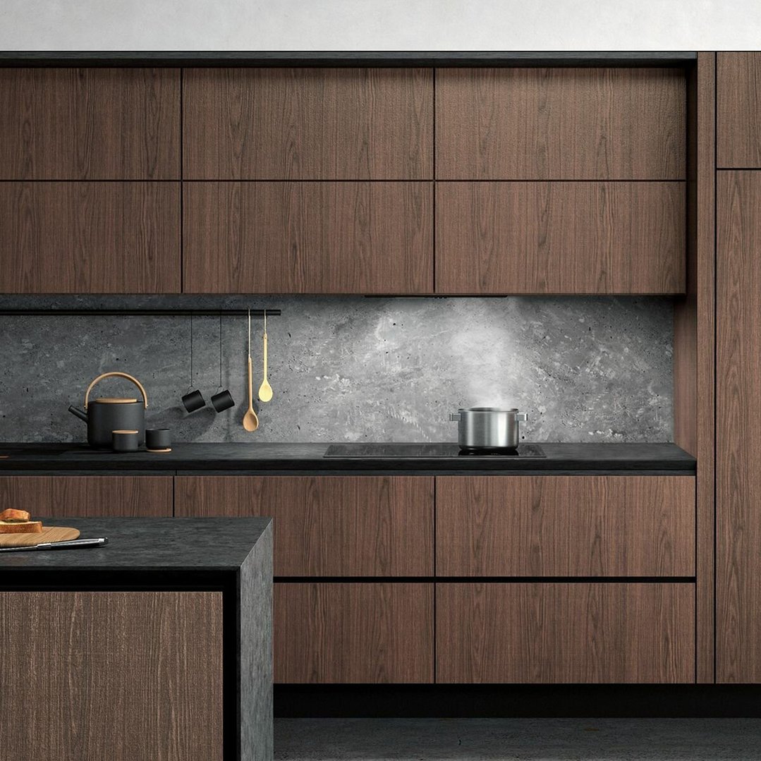 Integrated rangehood above a cooktop with a pot in a modern kitchen