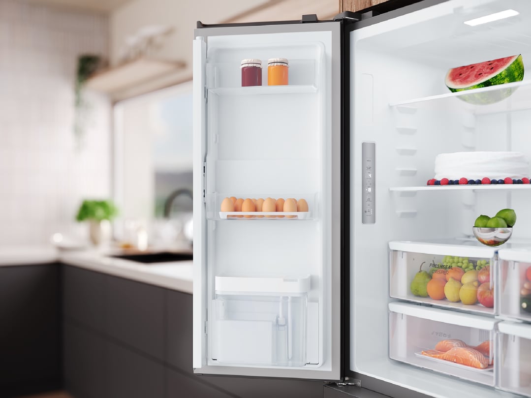 Open matte charcoal black quad door fridge in a modern kitchen