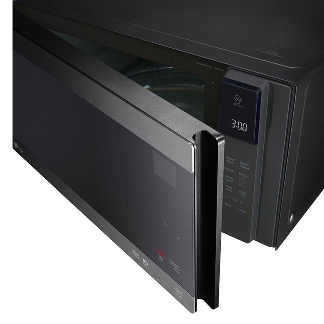 Black LG microwave oven with its door partially open, showing the interior