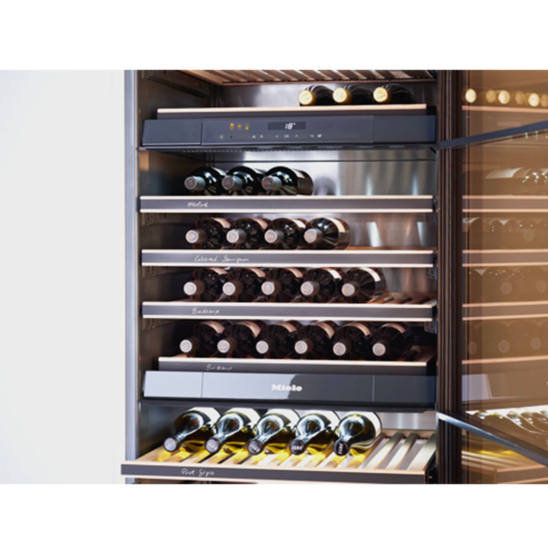 Close-up of a Miele Freestanding Wine Conditioning Unit filled with wine bottles