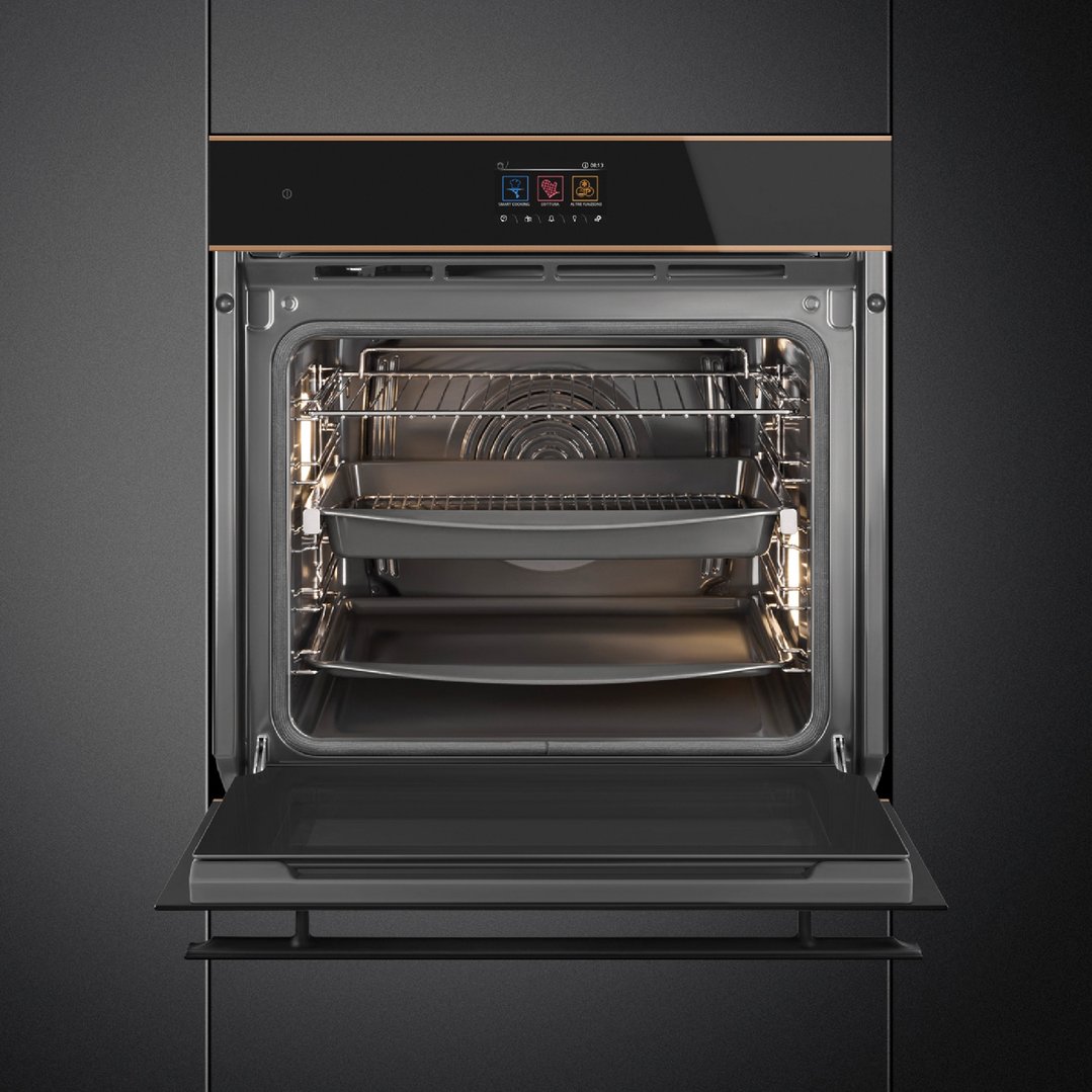 Built-in oven with door open, showing interior racks and baking trays