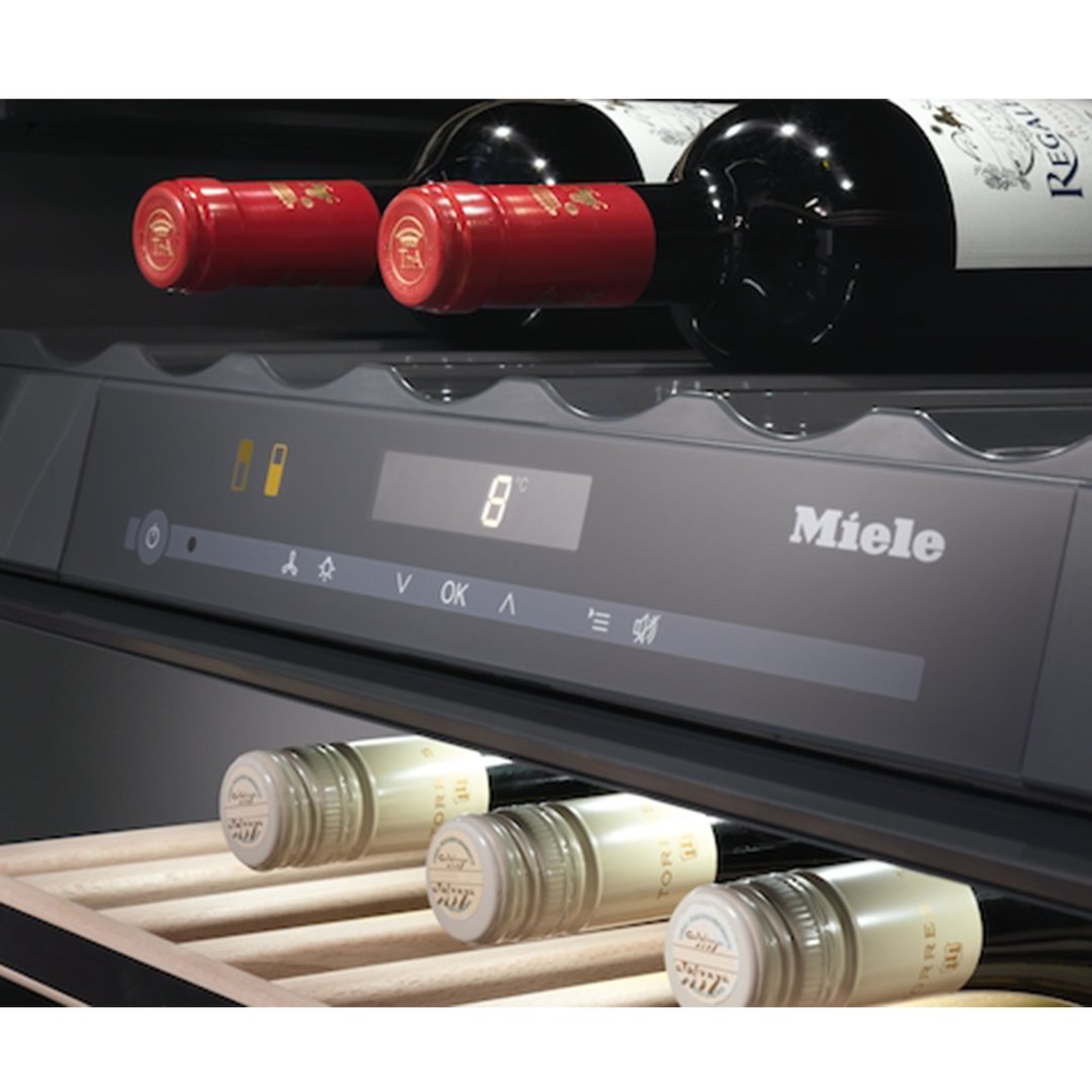 Close up of a Miele wine conditioning unit with bottles and digital display