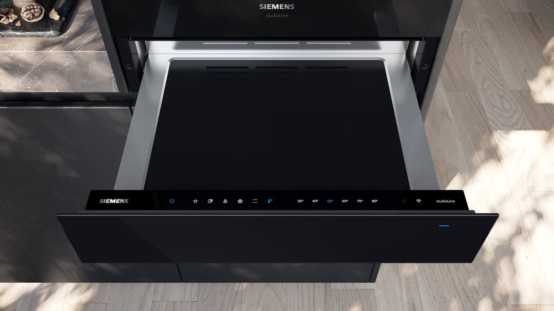Siemens warming drawer with control panel extended in a modern kitchen setting