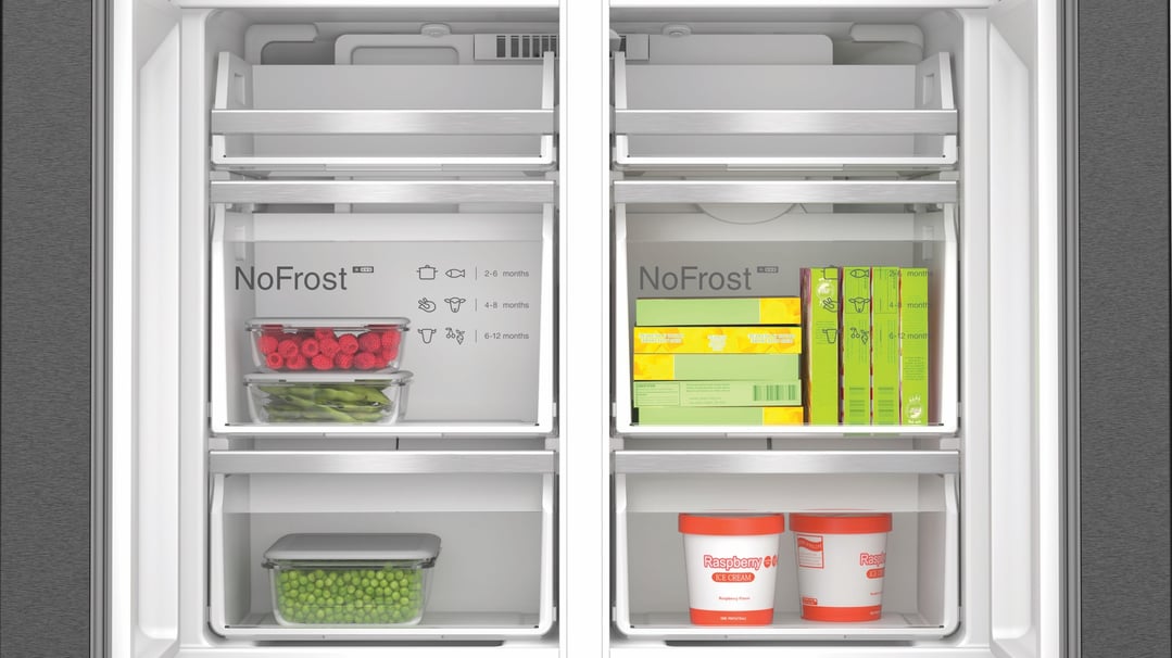 Open Bosch Series 6 Multi Door Fridge Freezer showing frozen food items