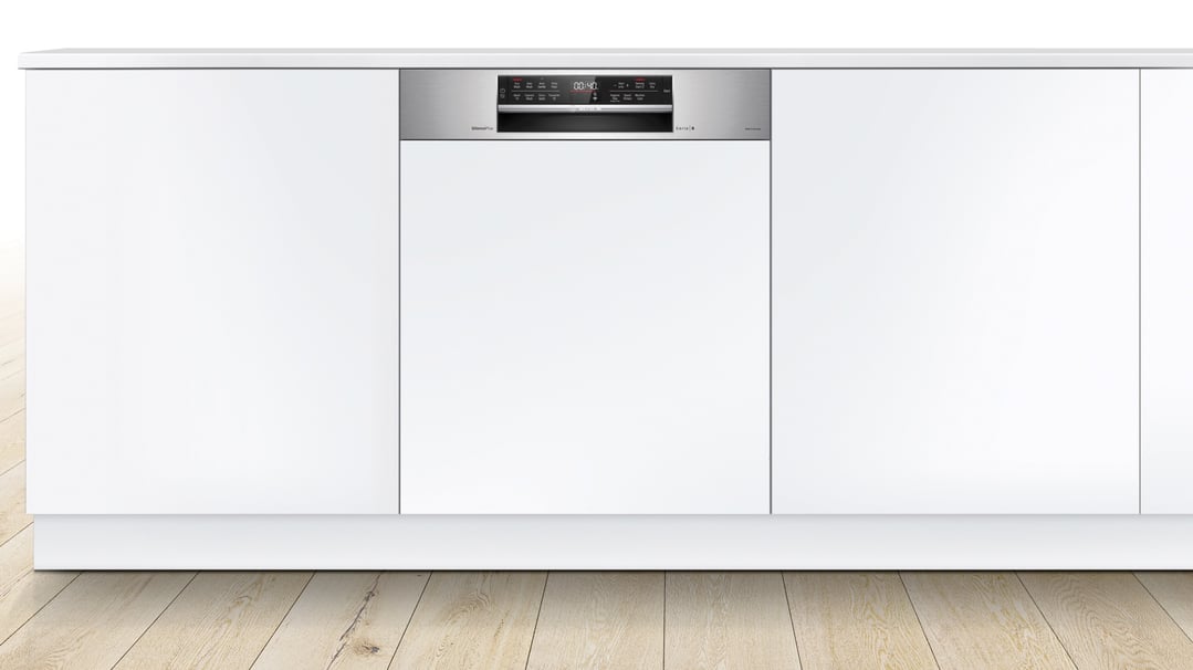 Bosch Series 6 semi-integrated dishwasher installed in a white kitchen cabinet