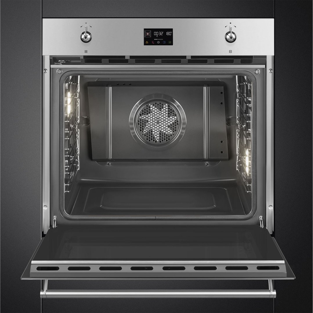 Open built-in oven with illuminated interior and digital display showing time and temperature