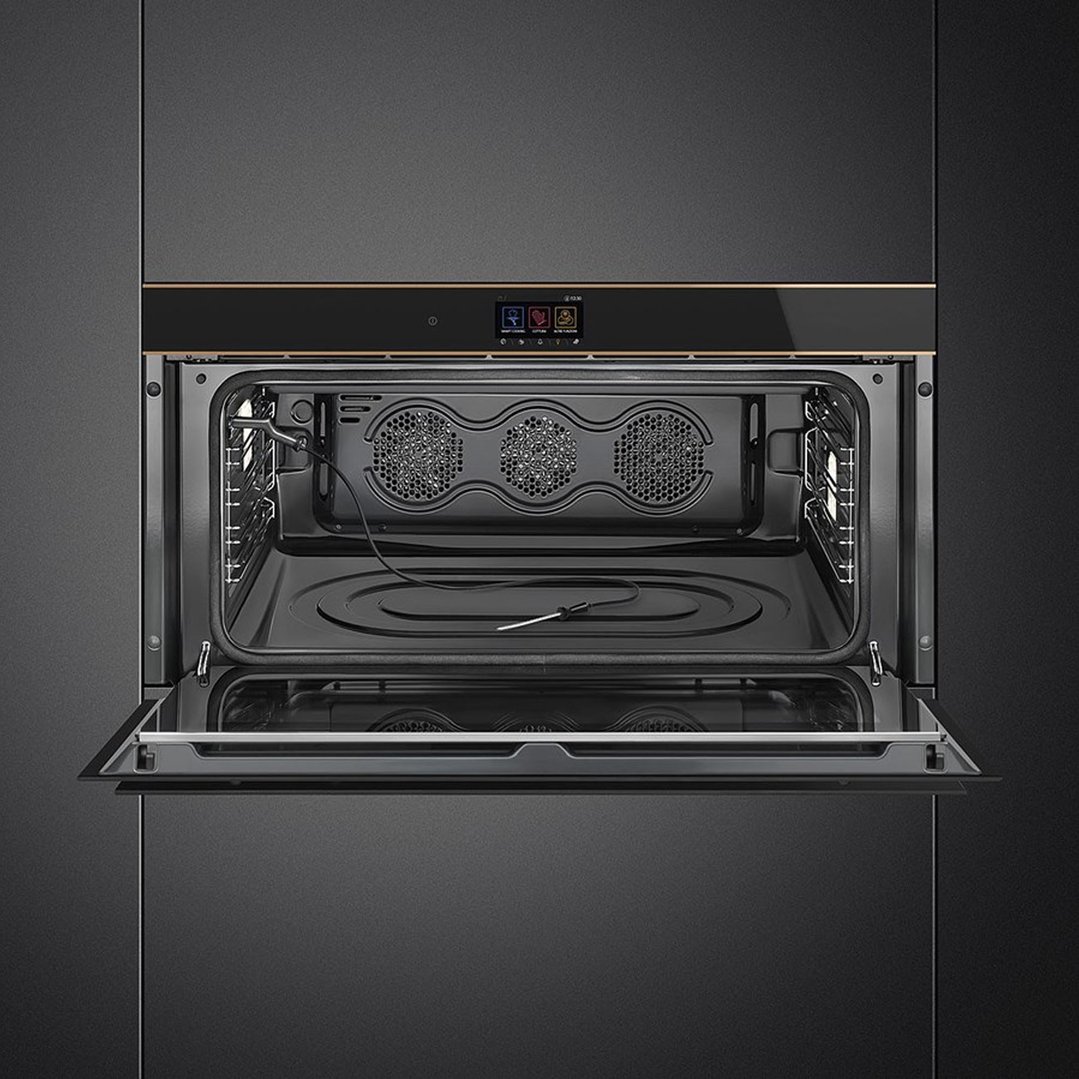A black built-in oven with its door open, showing the interior and controls