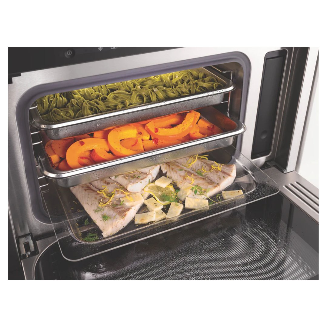 Open steam and microwave combination oven with food on three levels