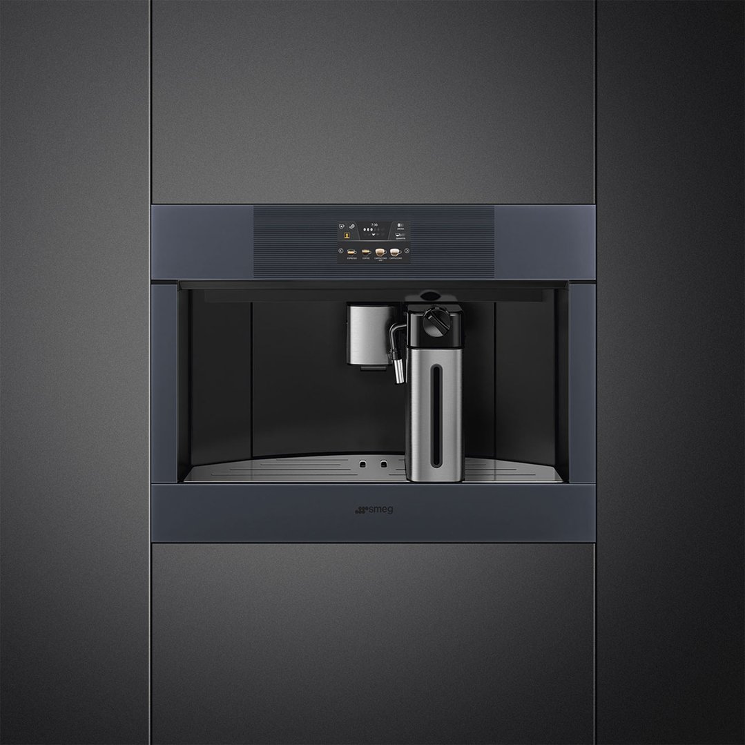 Built-in coffee machine with milk frother and display, installed in a dark kitchen