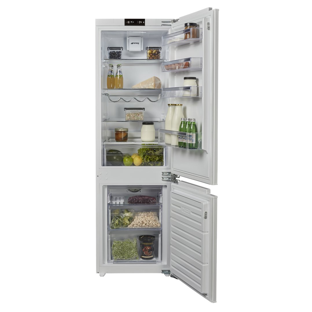 Integrated refrigerator and freezer with doors open, filled with food items