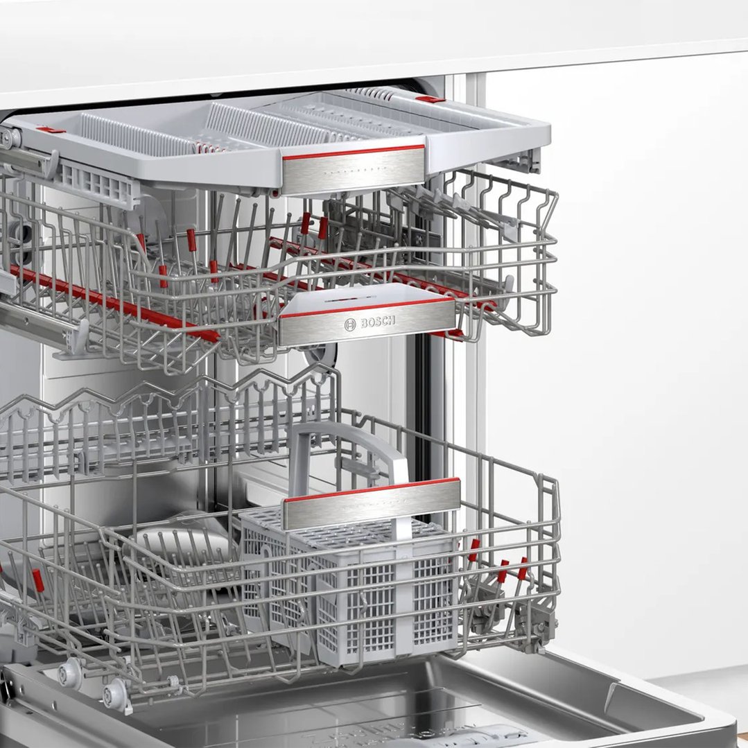 Interior view of a Bosch dishwasher with racks pulled out