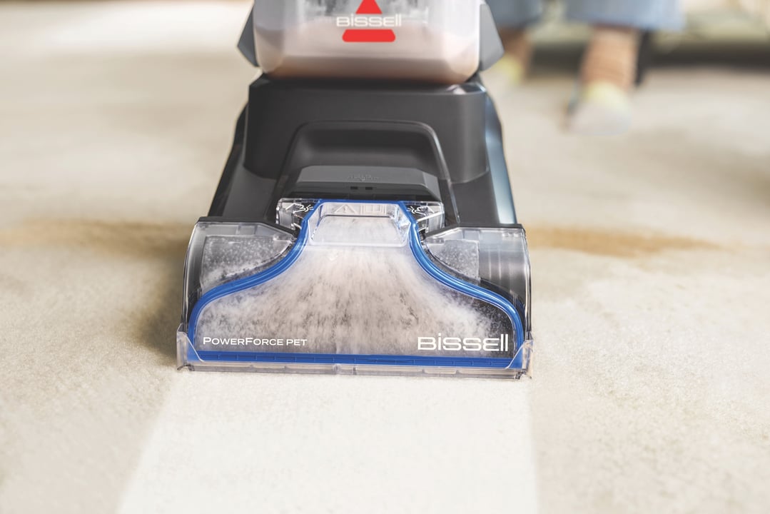 BISSELL PowerForce Pet upright carpet cleaner cleaning a dirty carpet