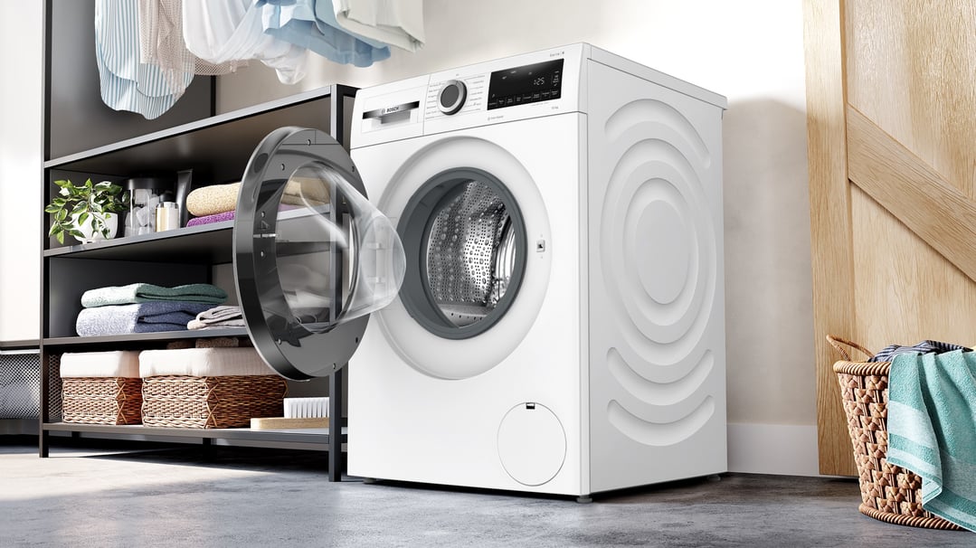 White Bosch 10kg Series 6 Front Loader Washing Machine with door open in laundry room
