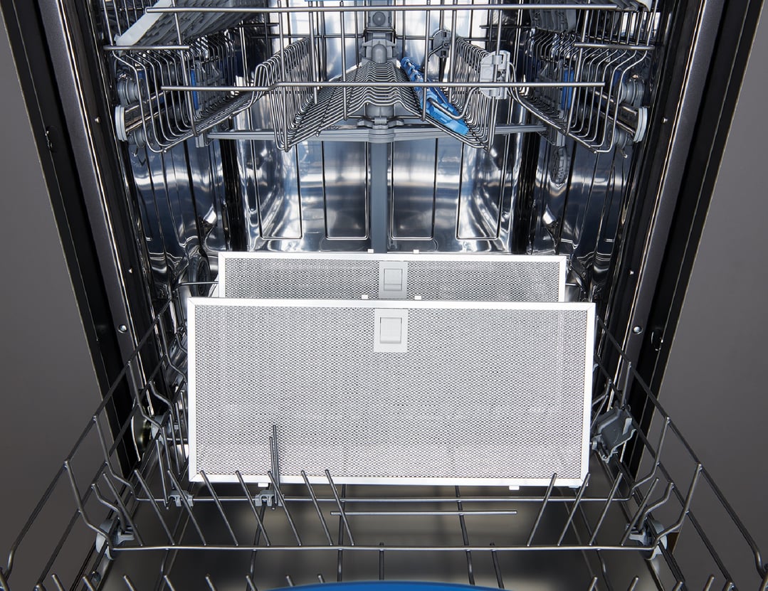 Two rangehood filters inside a dishwasher rack