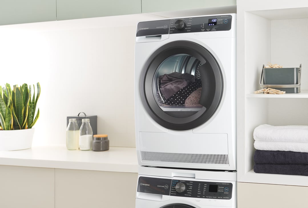 Westinghouse 8kg EasyCare 500 Series Heat Pump Dryer stacked in a laundry room