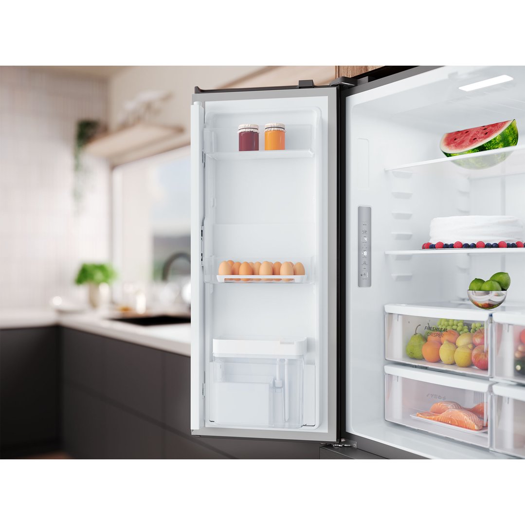 Open quad door fridge with food inside, in a modern kitchen