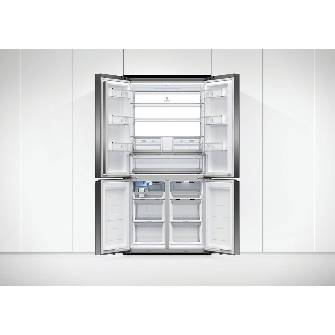 A quad door refrigerator freezer with all doors open, showing the interior shelves and drawers