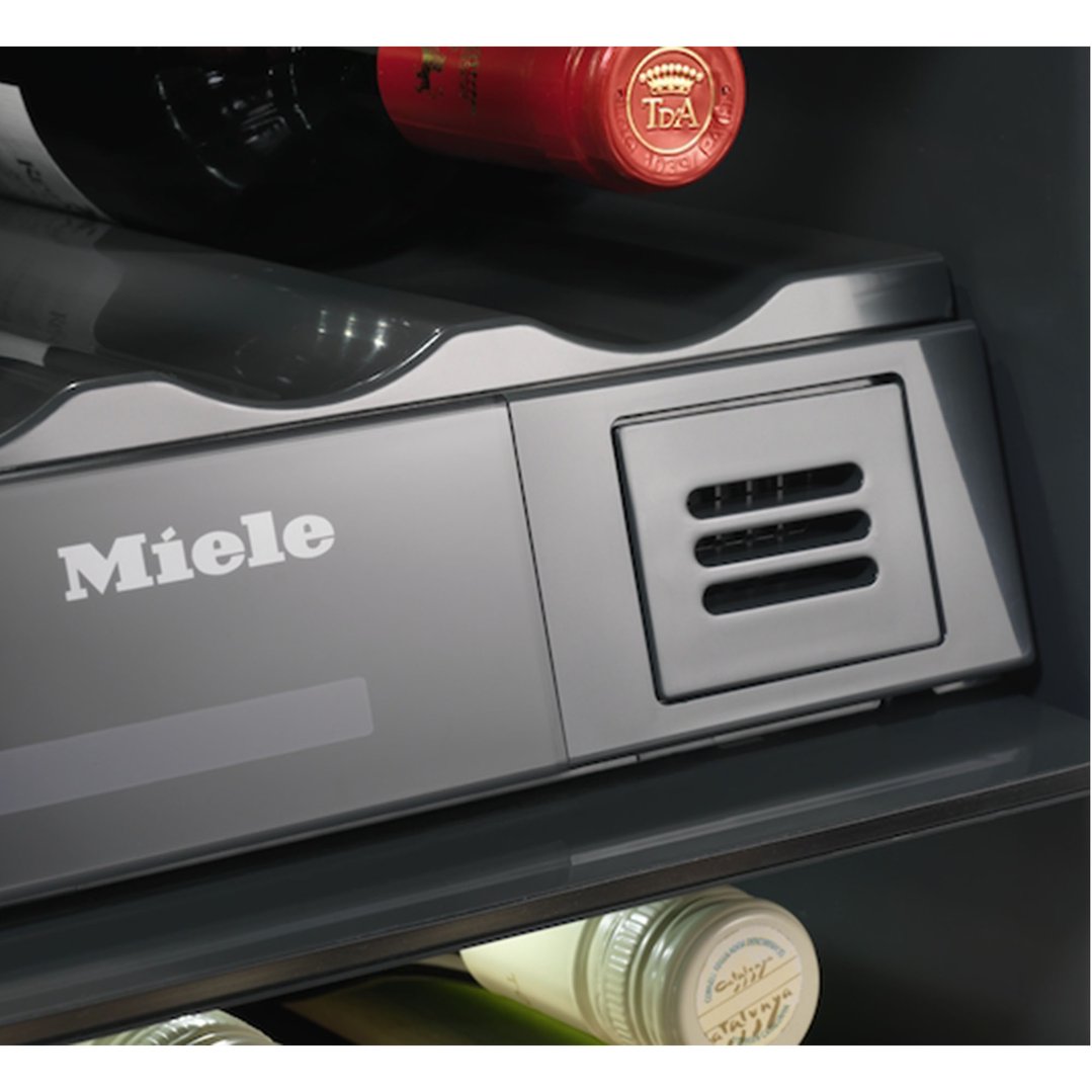 Close up of a Miele wine conditioning unit with bottles inside