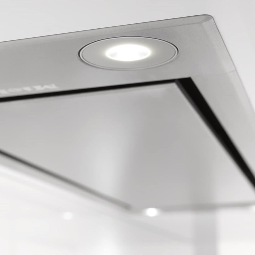 Close up of a built-in rangehood with an illuminated light