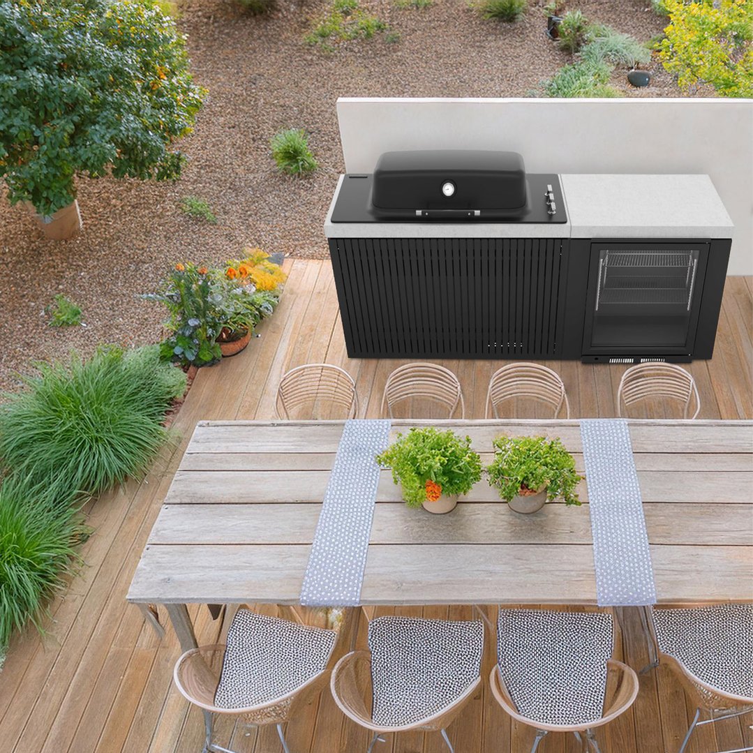 Overhead view of a built-in barbeque and outdoor kitchen on a wooden deck