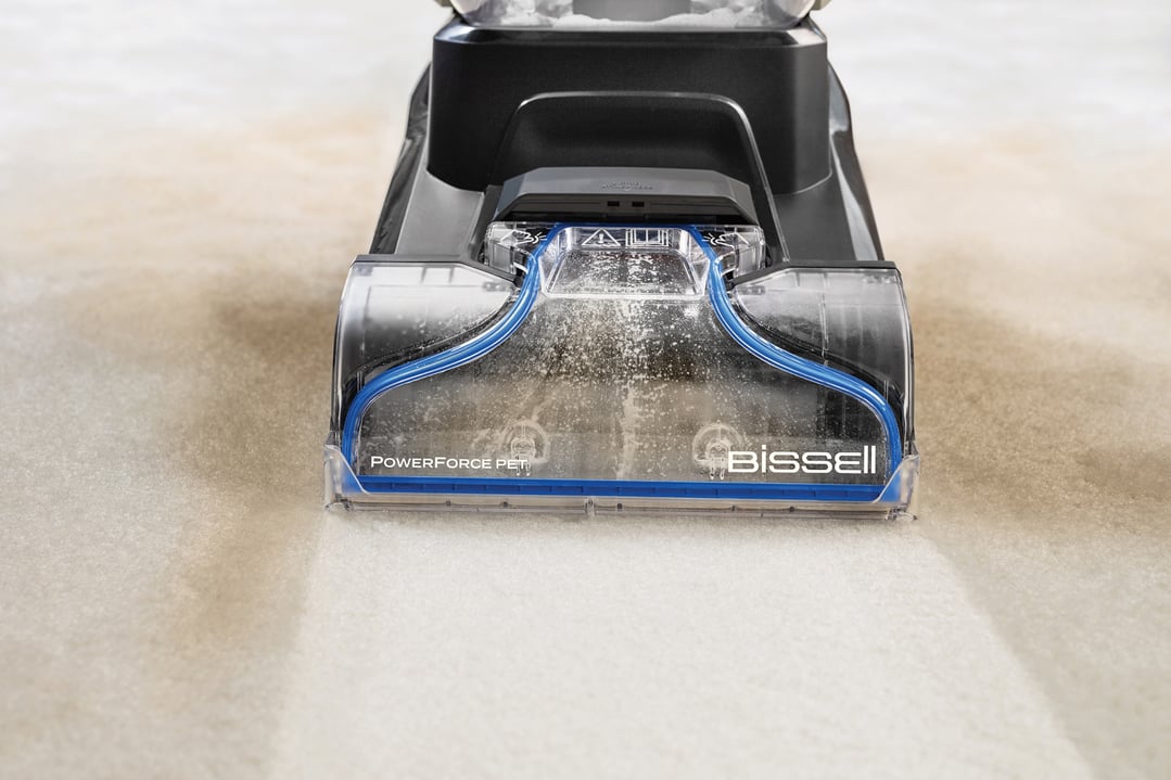 BISSELL PowerForce Pet vacuum cleaner cleaning a dirty carpet, showing clean path
