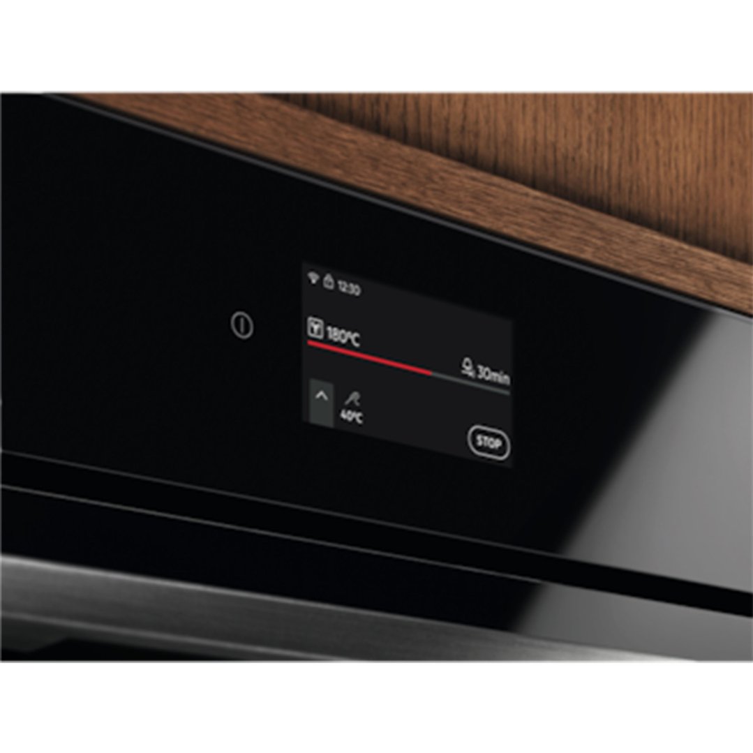 Close up of an oven's digital display showing temperature and timer