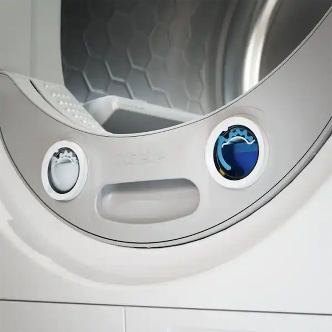 Close up of the control panel and drum of a white heat pump dryer