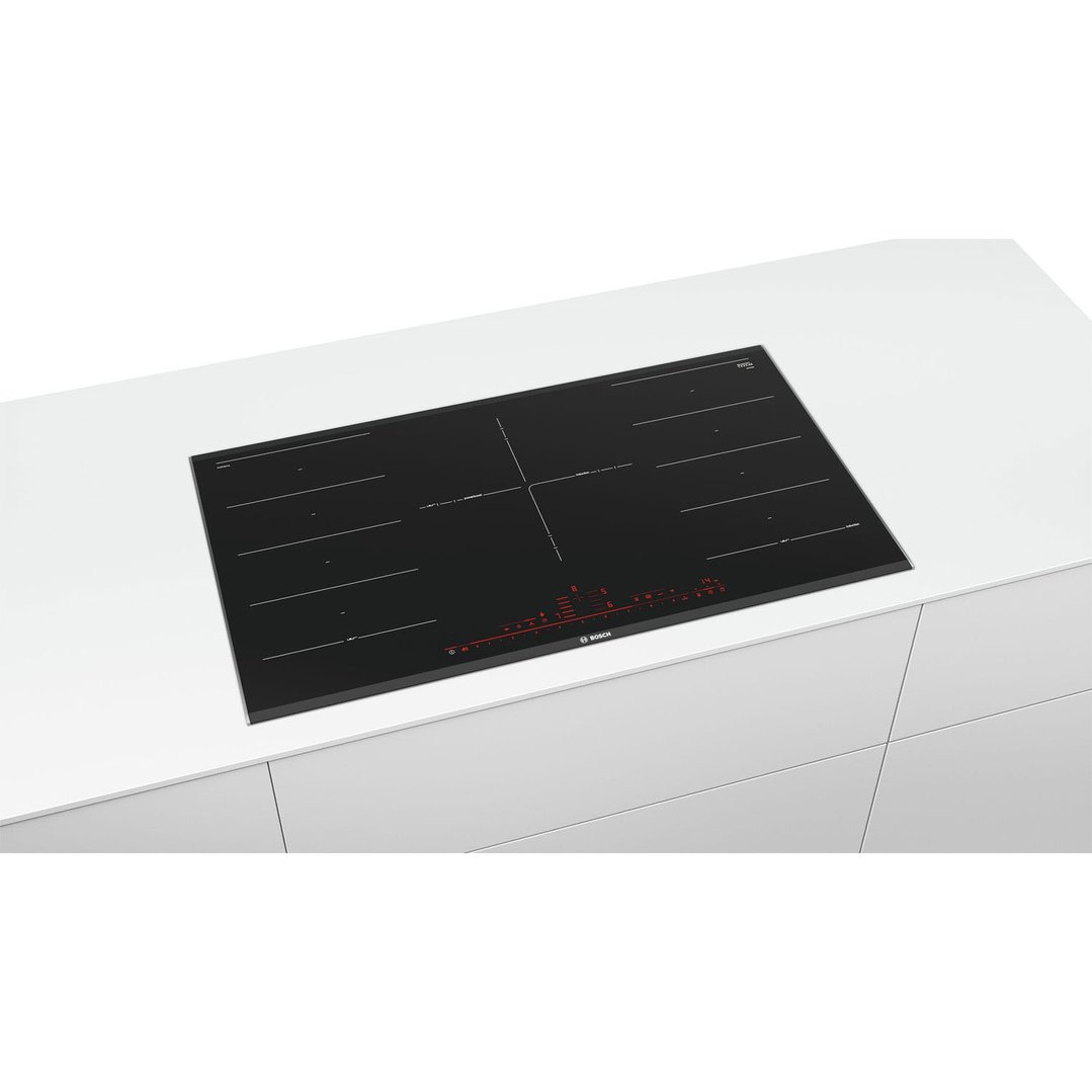 Black Bosch induction cooktop built into a white kitchen counter