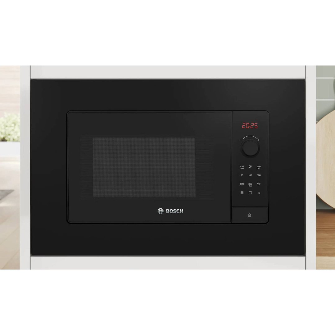 Built-in Bosch microwave oven with a black finish in a kitchen setting