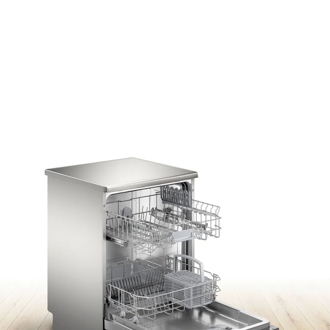 Stainless steel dishwasher with racks pulled out, on a wooden floor